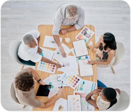 A group of people at a table looking over color swatches
