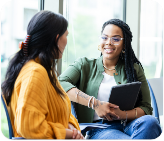 A psychologist sitting down with a patient to have a discussion.