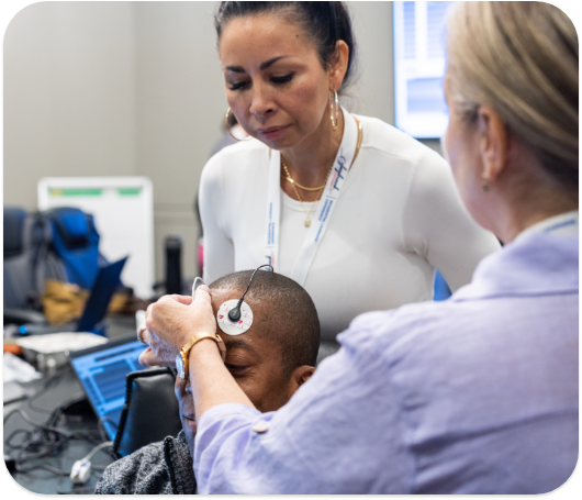 A teacher showing students how to do neurofeedback.