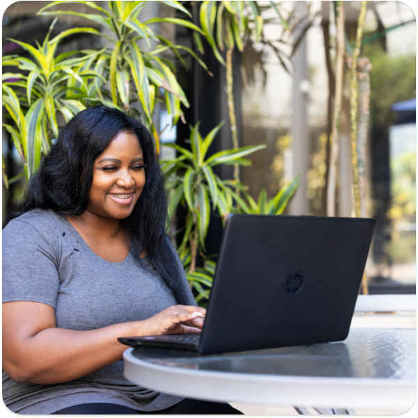 Student studying on laptop outside