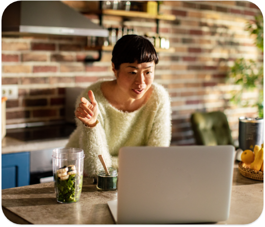 A woman coaching a client about nutrition online.